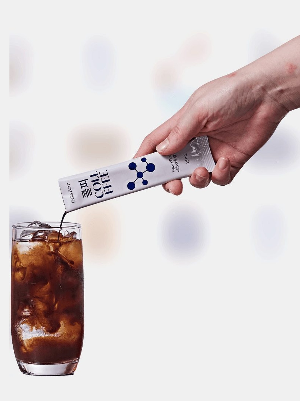 Pouring a stick into iced coffee